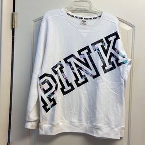 White Victoria’s Secret fleece shirt.